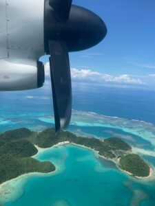 Plane shot from Siargao Philippines, with paradise island crystal blue water 