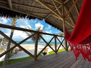 A tranquil terrace overlooking the vast ocean, featuring a comfortable hammock for a relaxing and scenic retreat.