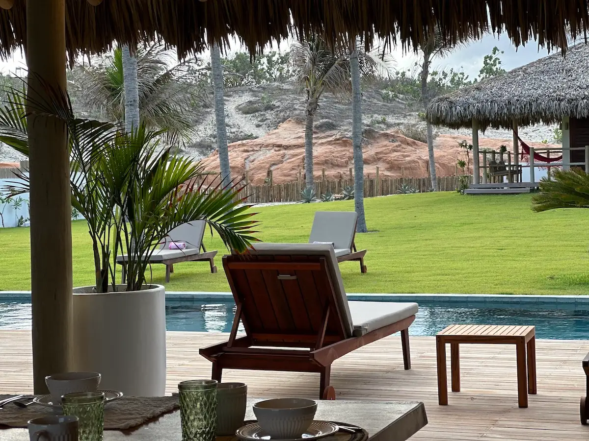 Sunbeds positioned to overlook a refreshing pool, providing a perfect spot to relax and enjoy the inviting waters.