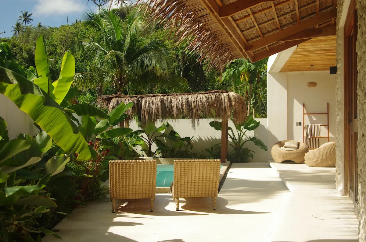 Refreshing pool surrounded by lush greenery, perfect for soaking up the sun.