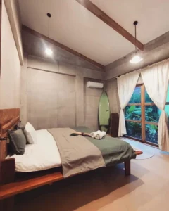 Unwind after a day of kitesurfing in this cozy modern room at Kitevoyage Kitecamp Siargao. Your board awaits your next adventure!