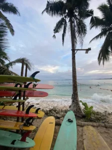 Surfboard in front of a wave spot in Siargao Philippines. Perfect place for surf travel
