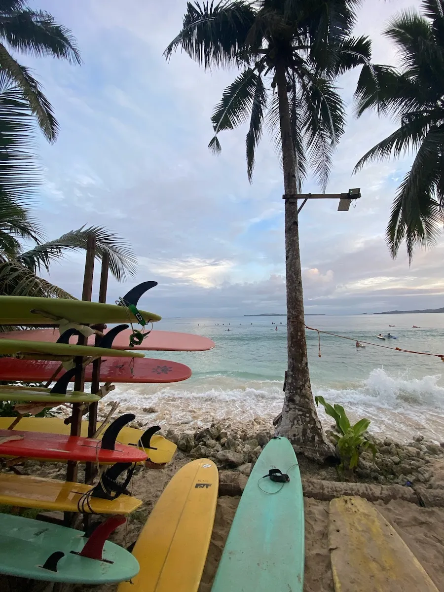 Surfboard in front of a wave spot in Siargao Philippines. Perfect place for surf travel