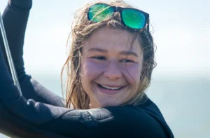 kitesurf teacher with a large smile while teaching