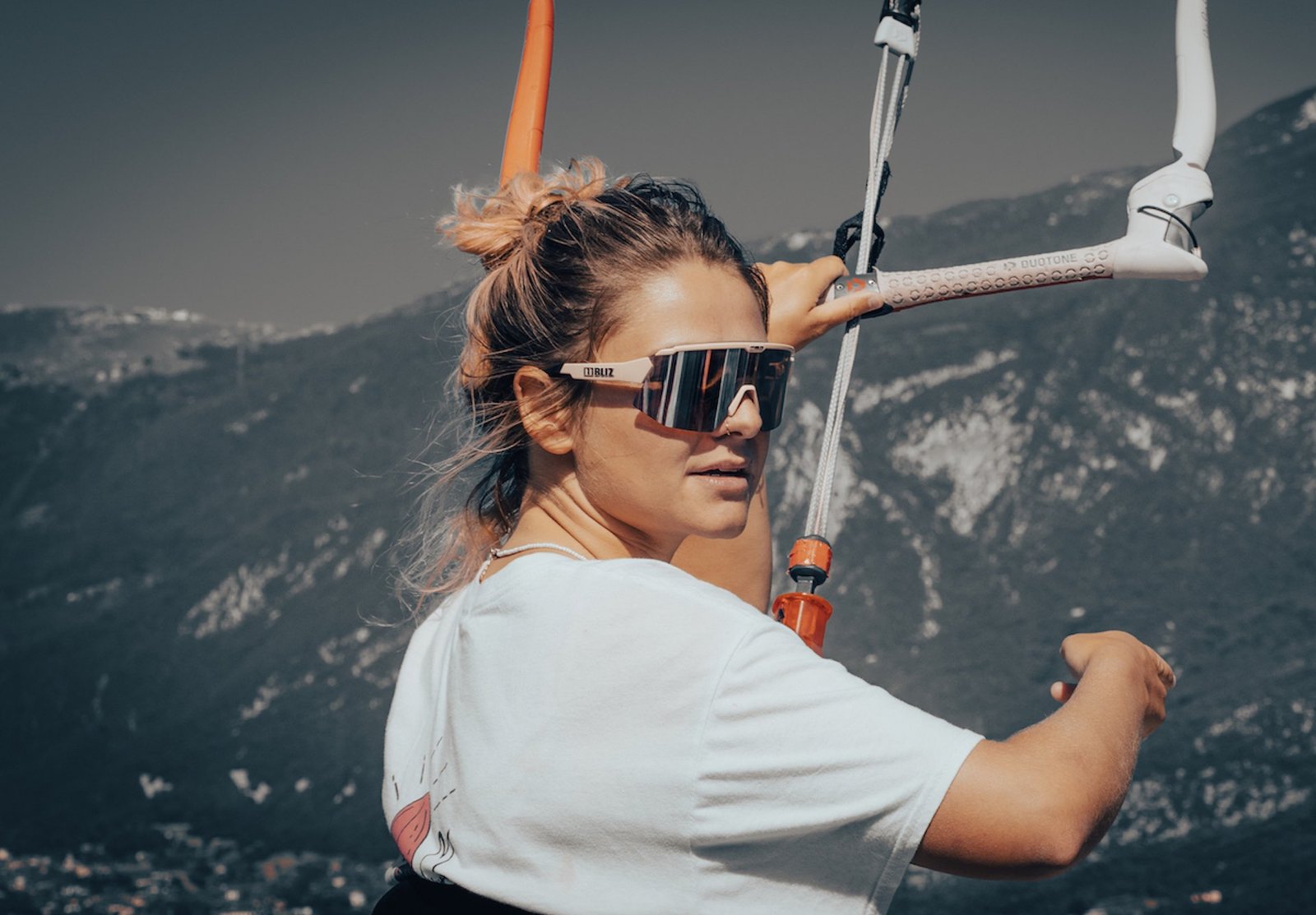 Marie from kitevoyage, portrait on a boat during kitesurf lesson on lake garda during kitesurf camp of kitevoyage 
