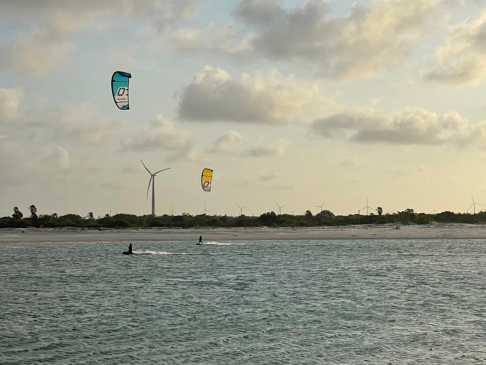 Two kitesurfer enjoying the sunset in brazil during kitevoyage kitecamp