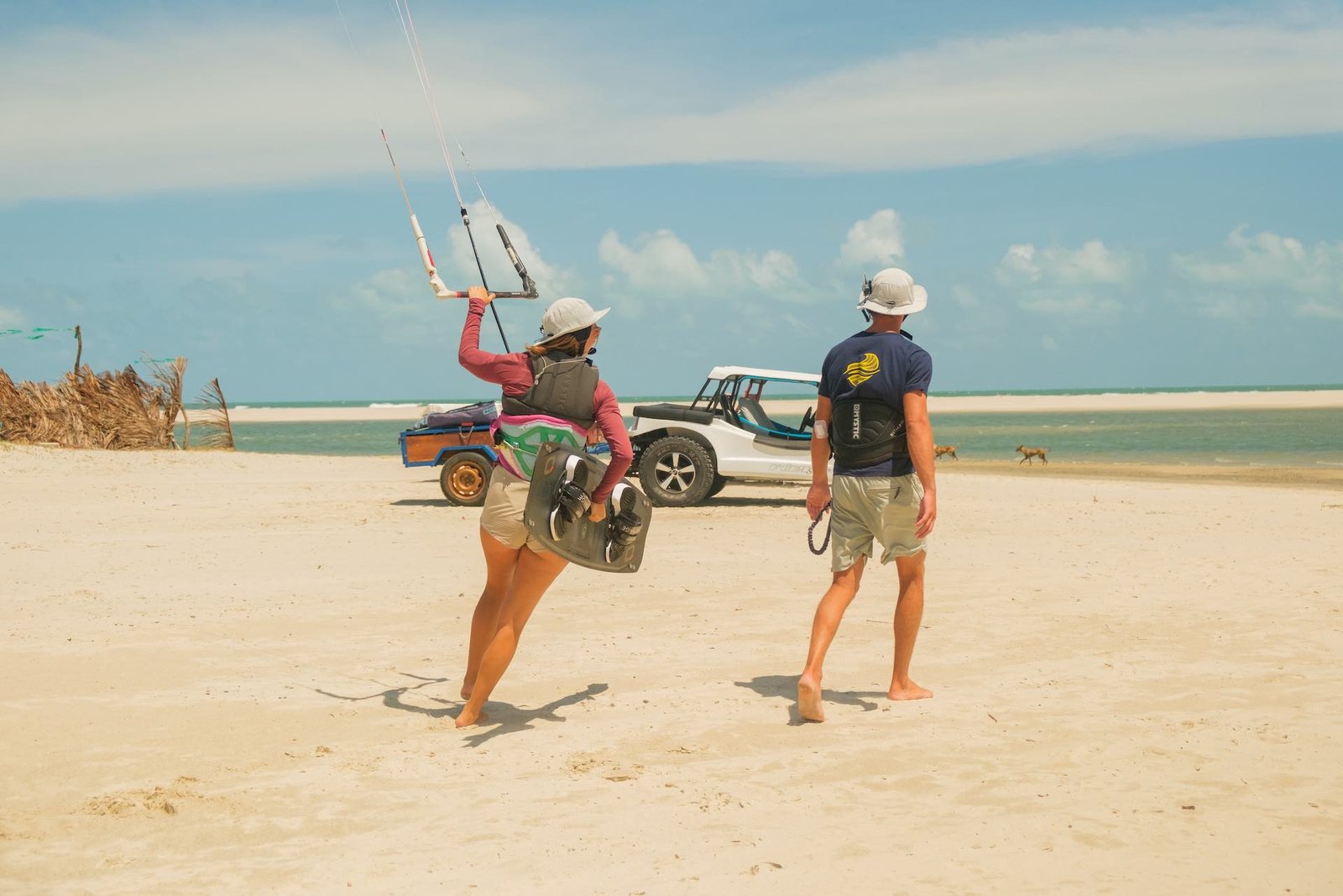 kitesurf instructor from the kitecamp of kitevoyage in brazil walkin to the lagoon