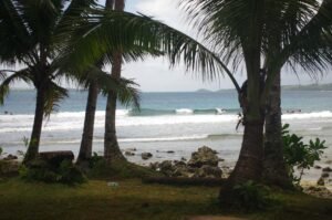 Surf spot in Siargao Philippines with perfect condition and rider enjoying the wave & the sun