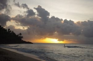 Surfer enjoying a beautifull sunset in Siargao Philippines 