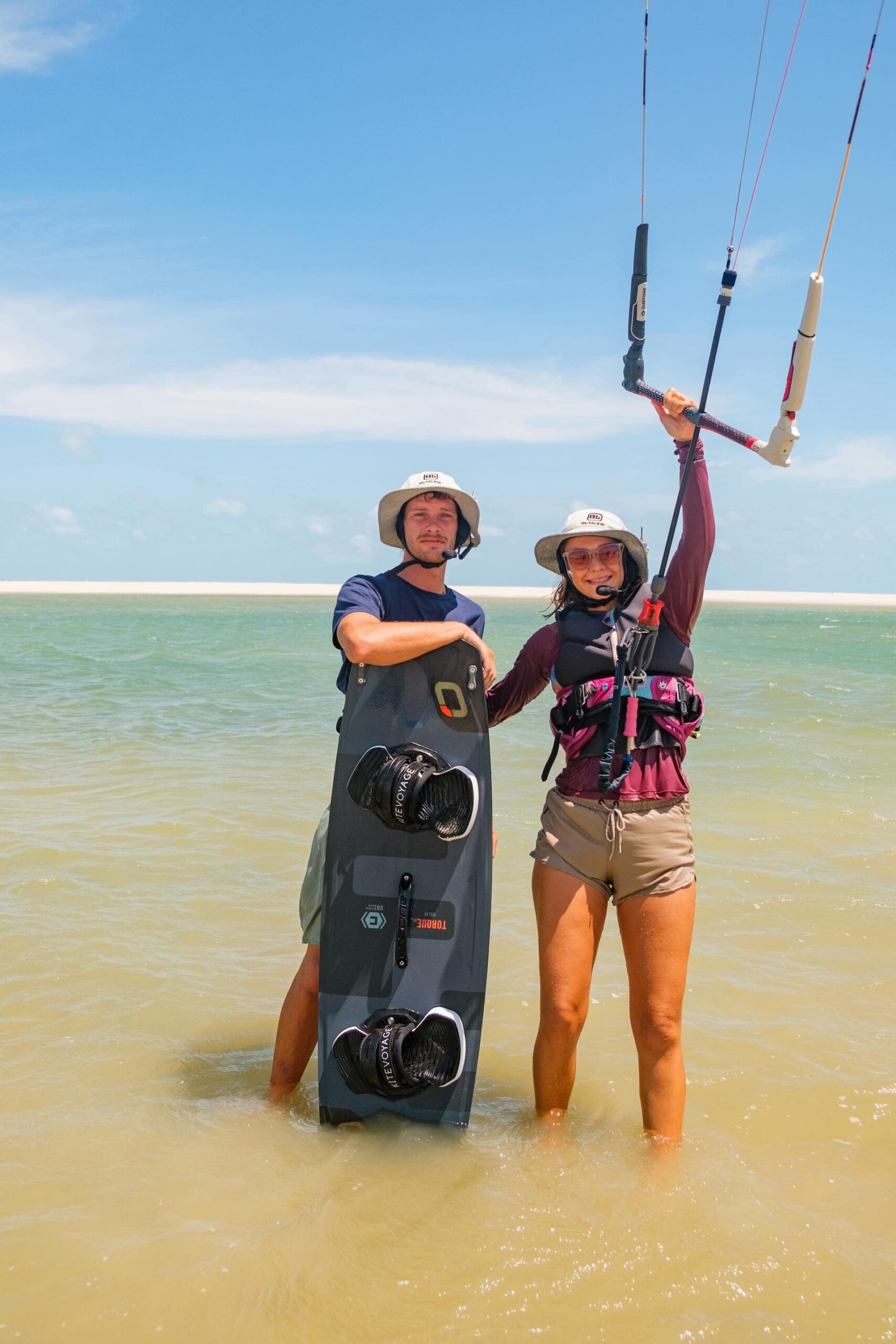 Portait of Alberic and Marie in the lagoon of brazil during a kitesurfing session with kitevoyage kitecamp