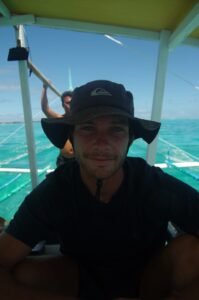 Alberic from kitevoyage portrait in a boat from Siargao Philippines, on he's way to an epic surfing session