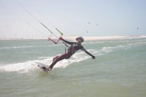 Student from Kitevoyage kitecamp, kitesurfing a lagoon of brazil where she could enjoy empty spot, warm water and the perfect condition of Brazil