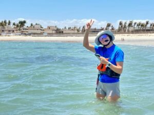 Marie wingfoil and Kitesurf Instructor from kitevoyage kitesurf camp giving a lesson in a beautiful lagoon of Brazil 